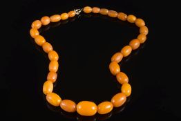 A graduated amber coloured,