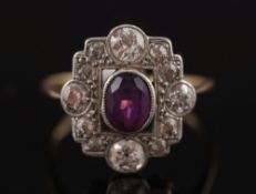 An amethyst and diamond rectangular cluster ring: with central oval amethyst within a border of