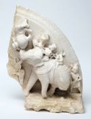An Indian carved marble plaque:, of semi arched outline,