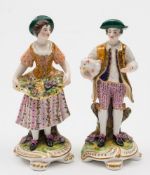 A pair of Sampson Hancock (Derby) figures: of the French Shepherd and French Shepherdess on flower