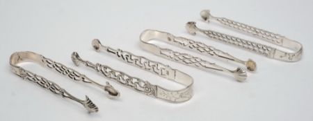A pair of Georgian silver sugar tongs, maker GB: initialled with pierced decoration,