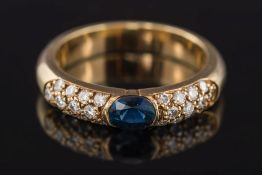 A sapphire and diamond half-eternity cluster ring: with central oval sapphire approximately 0.