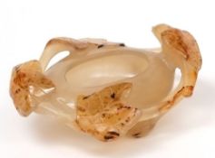 A Chinese agate brush washer: carved with a bird, leaves and branches,