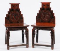 A pair of Chinese red and black lacquer side chairs:,