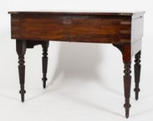 An early 19th Century rosewood and brass bound campaign writing desk:,