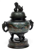 A Chinese bronze and champleve enamel tripod incense burner and cover:  with Buddhist lion finial,