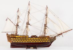 A scale model of HMS Victory:, fully rigged over detailed decks with cannon, lifeboats,