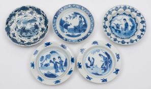 A group of five Chinese blue and white saucers: two with moulded rims,