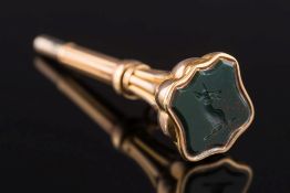 A late 19th century gold and bloodstone watch key: with deer head crest intaglio.