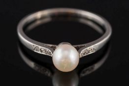 A 1930's platinum and single cultured pearl ring:, the cultured pearl 5.