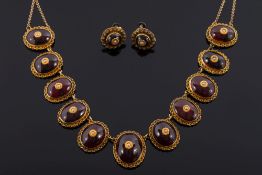 An Indian gold, cabochon garnet and seed pearl necklace: with graduated,