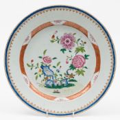 A Chinese famille rose porcelain charger: painted with ornamental pierced rockwork,