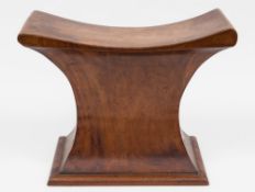 An early 19th Century mahogany saddle stool in the manner of Thomas Hope:,