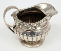 A George III silver cream jug, maker George McHattie, Edinburgh, date letter worn, possibly 1816:,