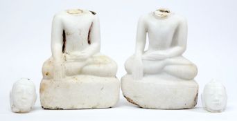 A pair of Indian carved marble figures of Buddhas:, seated in lotus position,
