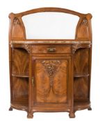 A French carved walnut dining suite of Art Nouveau design:,