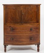 An early 19th Century mahogany and inlaid bow fronted adapted commode chest:,