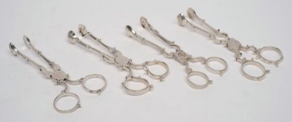 A pair of Georgian silver sugar nips, maker H.