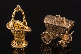 A 9ct gold gypsy caravan charm: with moving wheels and opening roof revealing a fortune teller and