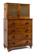 A 19th Century Colonial hardwood and inlaid secretaire cabinet:, the upper part with a reeded top,