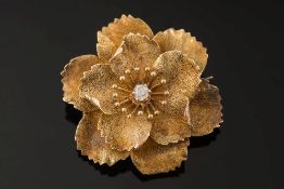 A diamond-set 'flower' pendant brooch: with central set, old-cut diamond, approximately 33mm long.