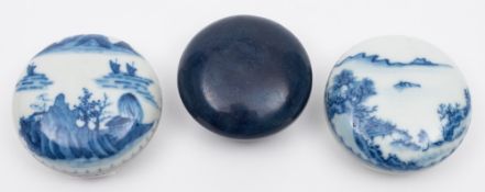 A group of three Chinese blue and white seal-paste boxes and covers: two painted with extensive