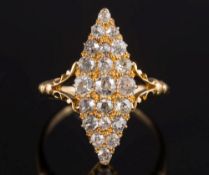 An early 20th Century gold and diamond mounted marquise-shaped cluster ring:,