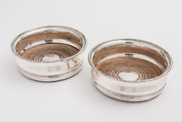 A pair of George III silver wine coasters, maker Robert Hennell I and Samuel Hennell, London,