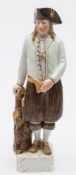 A Royal Copenhagen figure in national costume modelled by Carl Martin-Hansen: on square section
