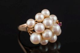 A cultured pearl and ruby-set cluster ring:, with 12 cultured pearls of various size and a small,
