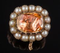 A 19th century gold, foiled topaz and split seed-pearl cushion-shaped brooch:.