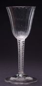An opaque twist wine glass: the ogee bowl with basal fluting the stem with a central gauze within