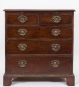 A George III mahogany rectangular chest:, the top with a moulded edge,