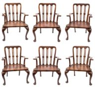 A rare set of six early 18th Century walnut open armchairs:,