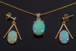 An oval opal and diamond pendant with single opal mounted drop earrings:.