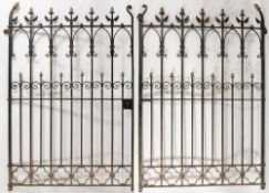 An imposing pair of wrought iron gates in the Gothic taste:,
