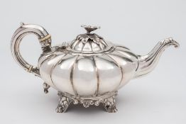 A Victorian silver teapot, maker William Hewitt, London, 1840: of circular lobed form,