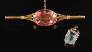 An oval pinkish peach coloured tourmaline single-stone bar brooch: and a single aquamarine drop