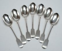 A set of seven George V silver fiddle pattern table spoons, maker Carrington & Co, London,