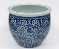 A Chinese blue and white jardiniere: the exterior painted overall with scrolling lotus below