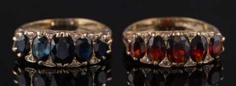 A 9ct gold and garnet five-stone ring: in scroll pierced setting,