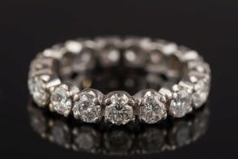 A diamond eternity ring: with seventeen circular, brilliant-cut diamonds each approximately 0.