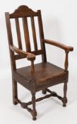 An 18th Century oak and fruitwood lambing armchair:,