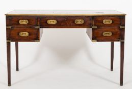 A mahogany and brass mounted writing table of military type:,