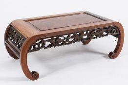A Chinese carved wood urn table:, the top with rectangular burr walnut fielded panel,
