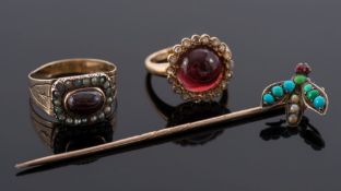 A circular cabochon garnet and rose diamond cluster ring:,