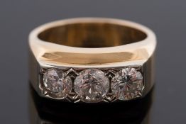 A gentleman's diamond mounted three-stone ring: with circular, brilliant-cut diamonds,