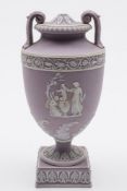 A Wedgwood lavender jasper ware vase and cover: of campana form with foliate scroll handles and