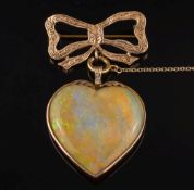 A heart shaped opal pendant: approximately 32mm long x 33mm wide,