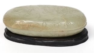 A Chinese jade box and cover: of flattened ovoid form,